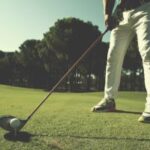 Golfer visualizing shot – using mental strategies to stay motivated